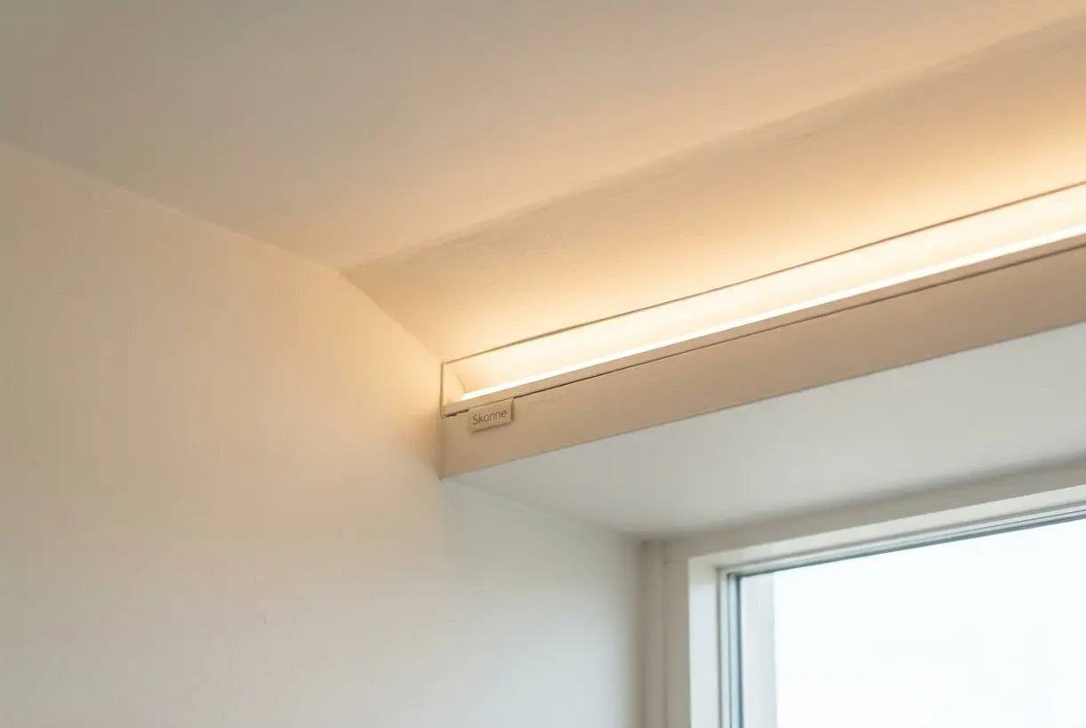 Living room LED strip lighting installed in ceiling cove casting warm ambient glow