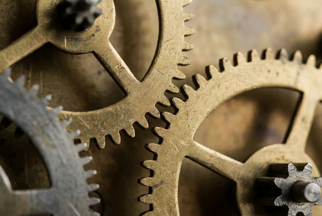 Vintage brass clock gears close-up showing intricate mechanical detail