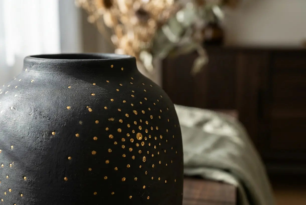 Handcrafted luxury ceramic vase with gold accents, artisan home decor detail